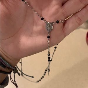 Sterling silver rosary necklace.
